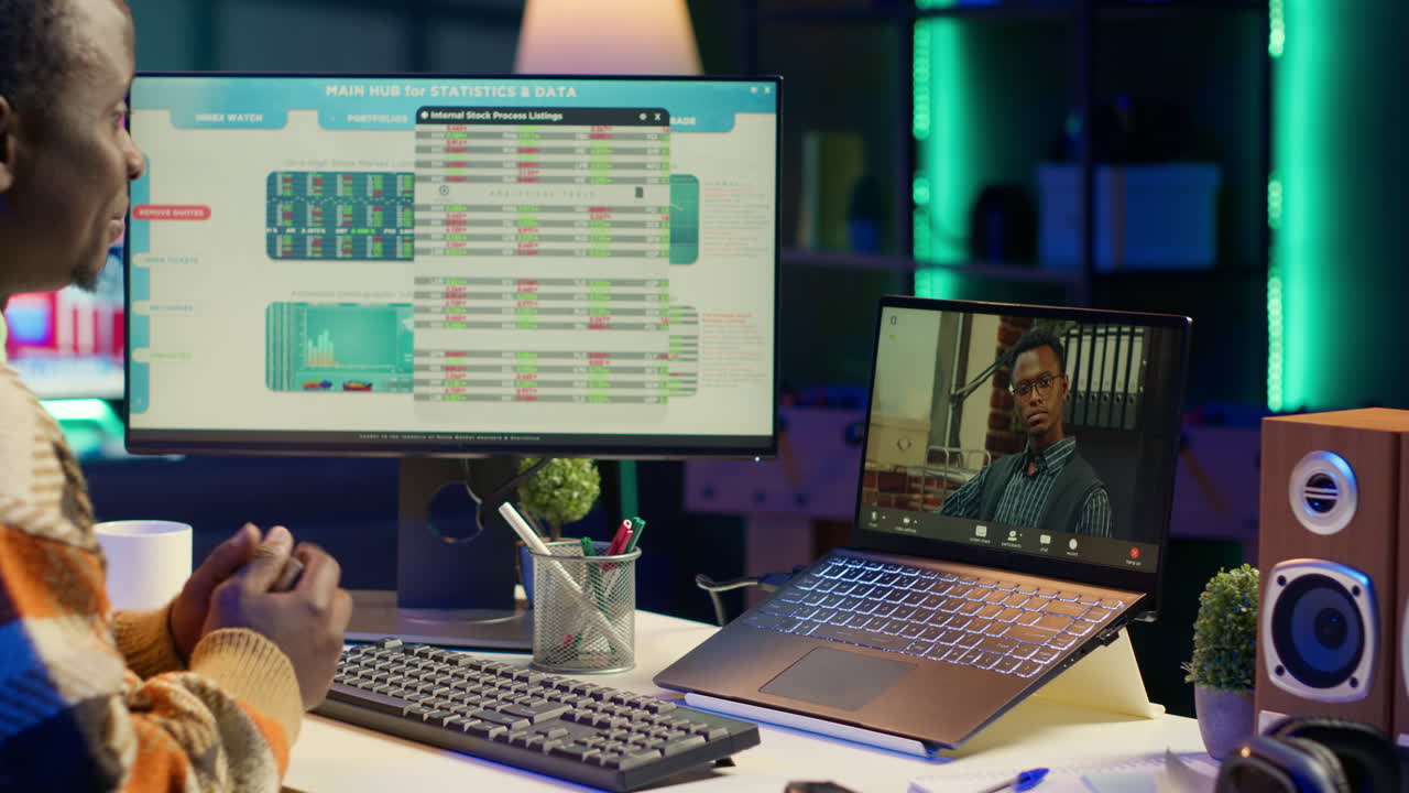 Business Meeting with Computer and Financial Data