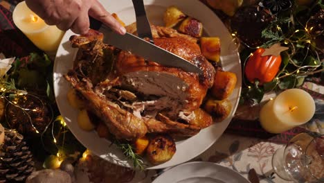 slicing-delicious-thanksgiving-deep-fried-turkey-with-knife,-overhead-shot