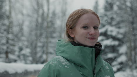 woman smiling in snowy forest