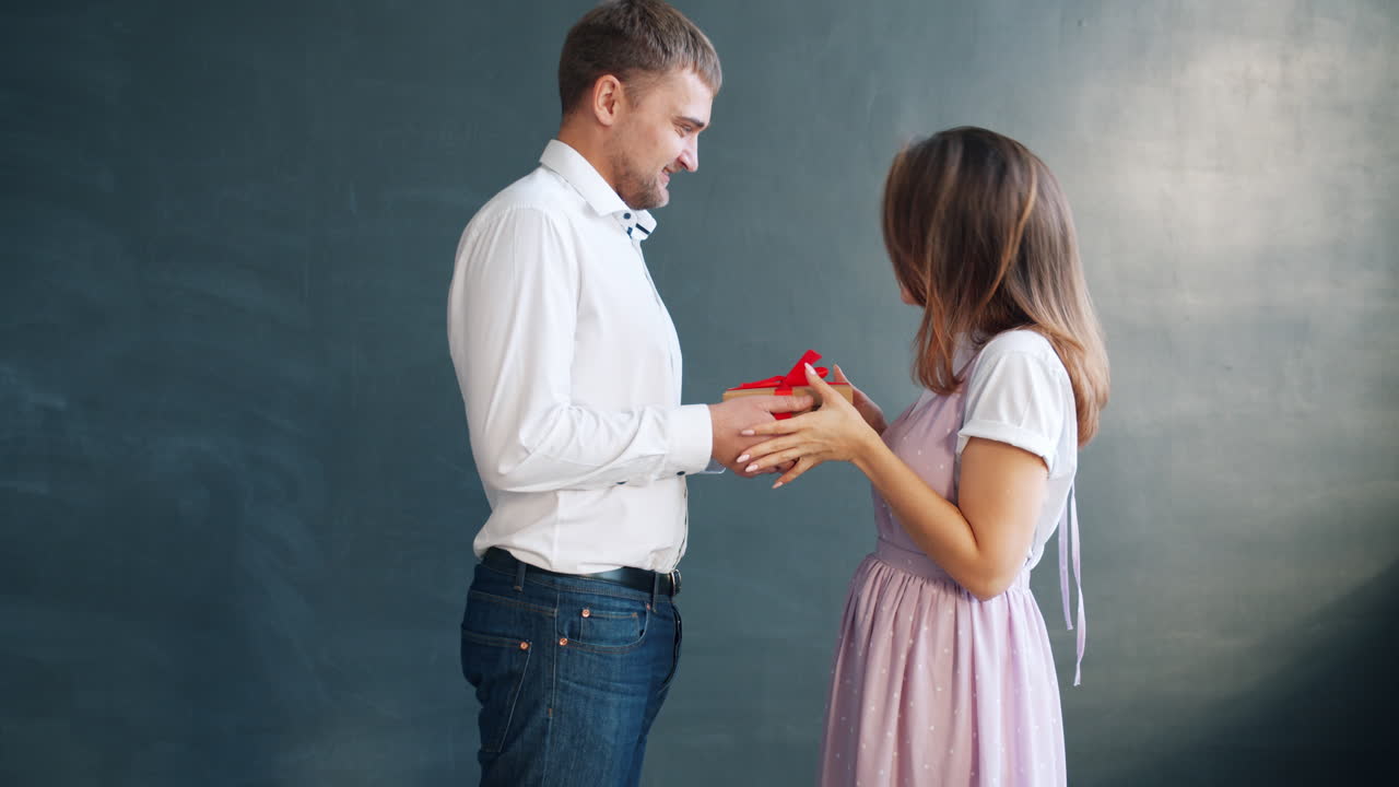 Couple exchanging a gift