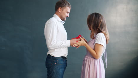 couple exchanging a gift