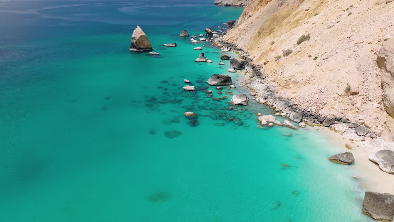 Outcrops On Turquoise Waters At Shoab Beach In Socotra Island, Yemen. Aerial Drone Shot