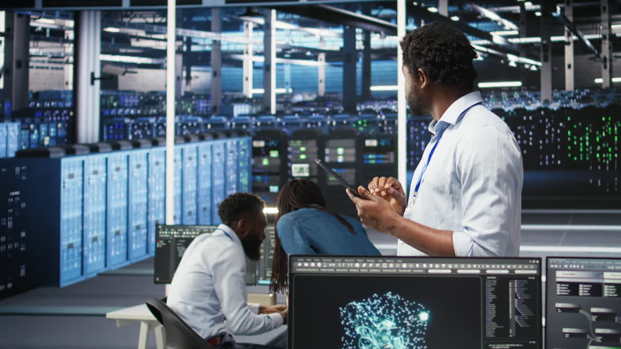Data center engineer using tablet to interpret AI generated data analytics graphs