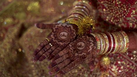 The-stunning-close-up-view-of-an-Asian-bride-in-her-hands-and-attire-is-truly-breathtaking