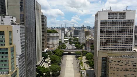Aerial-view-rising-over-a-pedestrian-street-in-downtown-Sao-Paulo,-sunny-Brazil