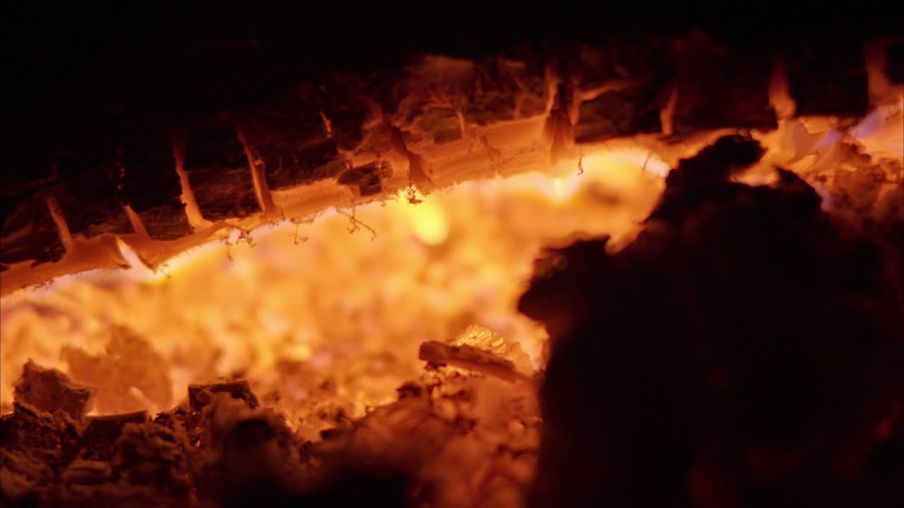 Close up of a wood log burning in a chimney