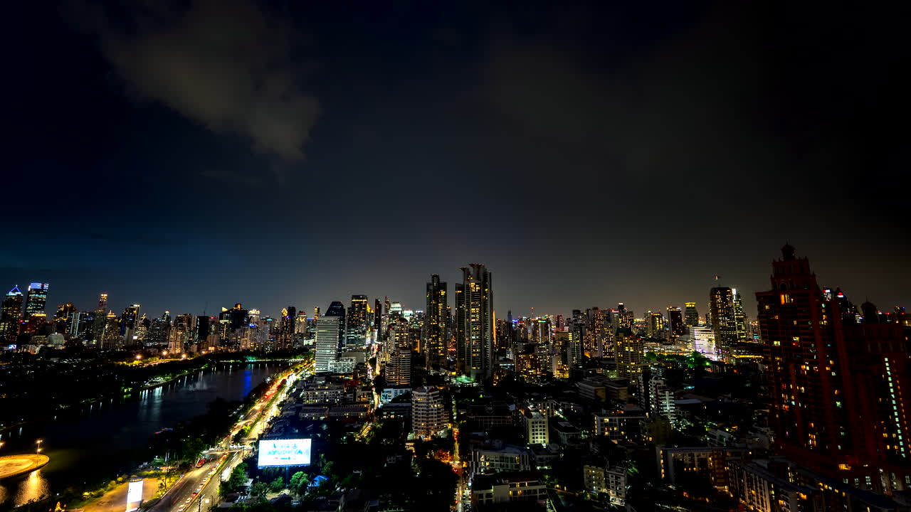 Timelapse of lightning strike in night sky over lit up Bangkok skyline, Thailand
