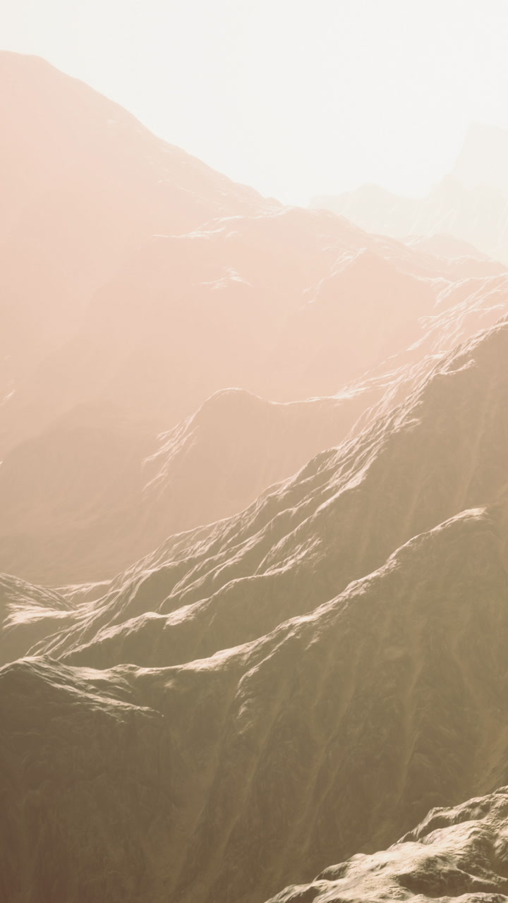Mountains and hills in soft light at sunrise creating a natural landscape