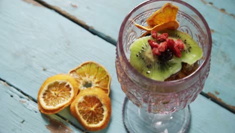 kiwifruit slice and dried fruits in glass bowl with dried orange slice 4k