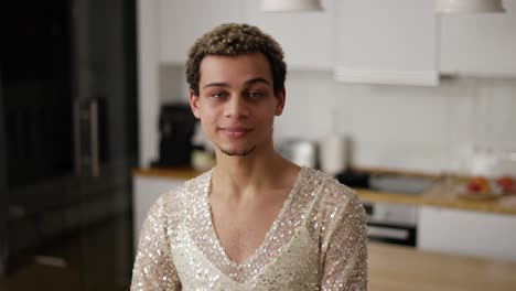 a portrait of a man in a dress looking to the camera