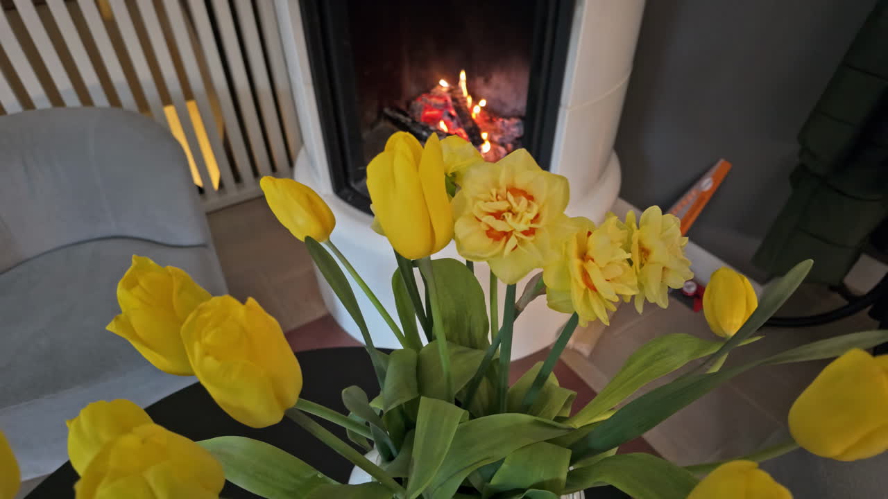 Yellow Tulips and Daffodils in front of a Cozy Fireplace
