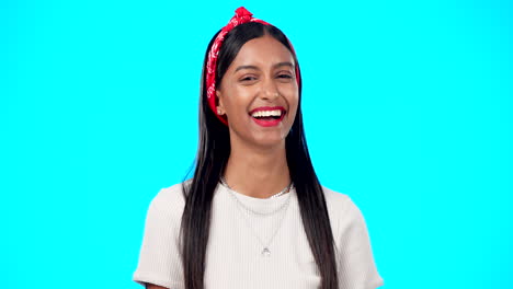 Happy-woman,-face-and-wink-on-blue-background