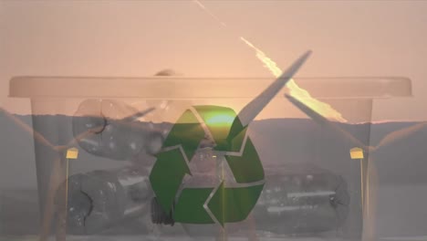Animation-of-green-recycling-sign-over-box-with-plastic-bottles-and-wind-turbines