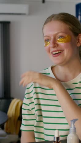 teenager applying gold eye patches