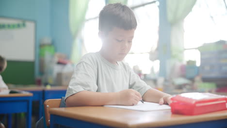 child in classroom studying