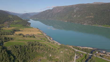 Aerial-View-Of-Vagavatnet-Lake-With-Calm-Waters-And-Mountain-Views-At-Daytime-In-Norway