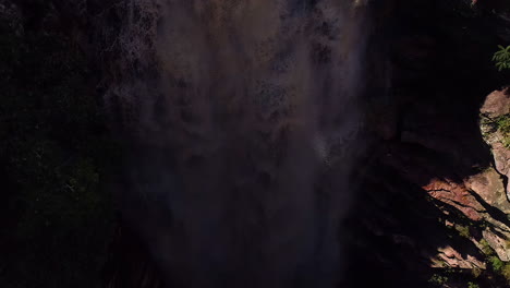 Aerial-view-of-a-waterfall-and-a-river-in-the-middle-of-a-big-vegetation,-Chapada-Diamantina,-Bahia,-Brazil