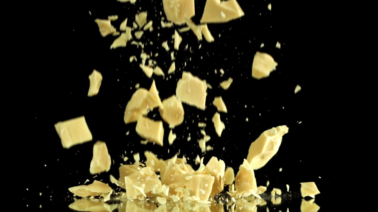 Delicious White Chocolate Chunks Falling in Slow Motion