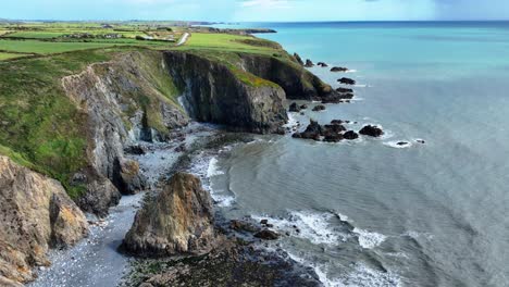 ireland epic coastline evidence of coastal erosion on the sea cliffs of the copper coast drive in waterford ireland on a calm summer morning