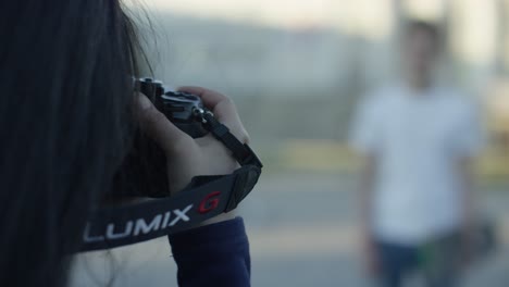 woman taking picture with a lumix g camera