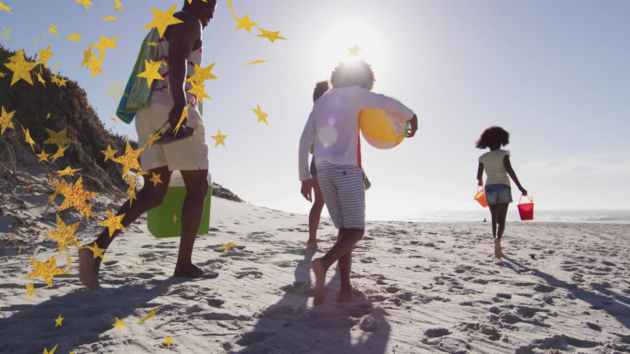 Family enjoying beach day with star animation overlaying sunny scene