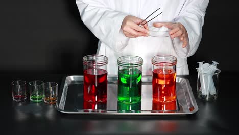 scientist conducts colorful dry ice experiment