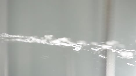 water spraying from faucet