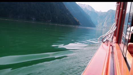 window view from the electric boat on the königssee surrounded by a beautiful mountain landscape