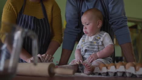 happy caucasian family baking together in kitchen