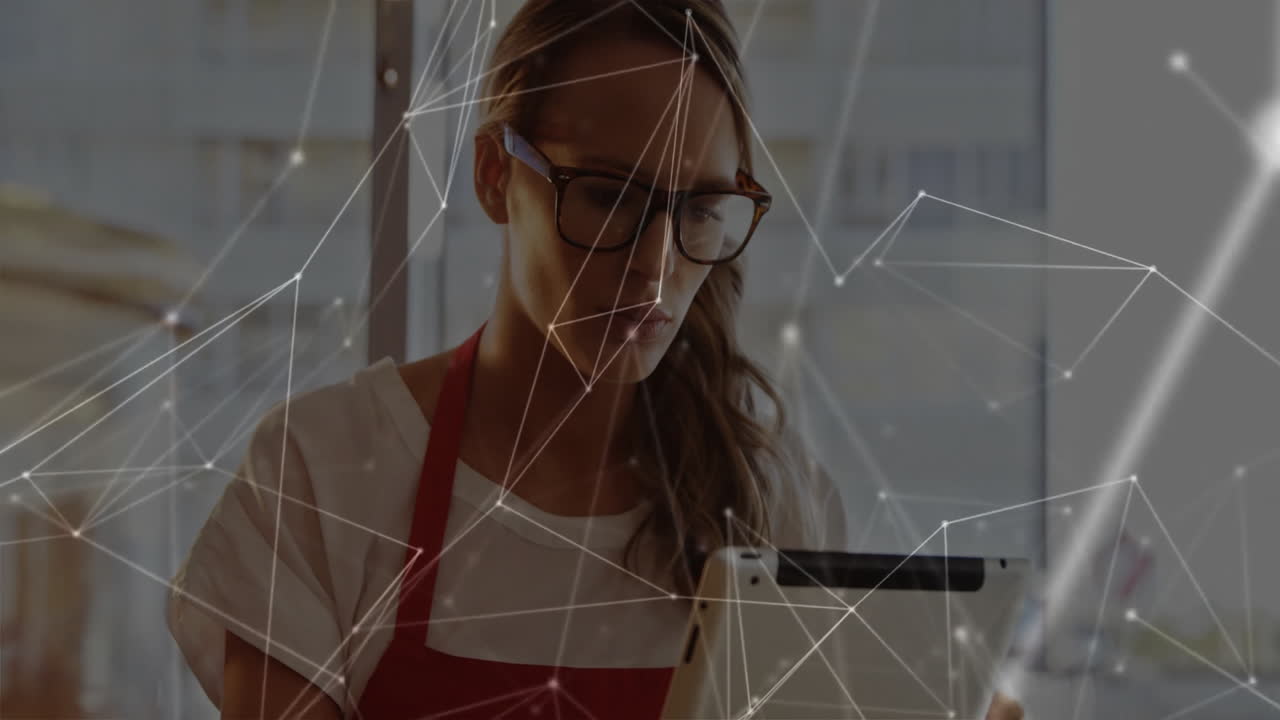 Using tablet with digital network animation, woman wearing glasses in school