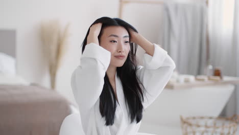 Woman Getting Ready in a Bedroom