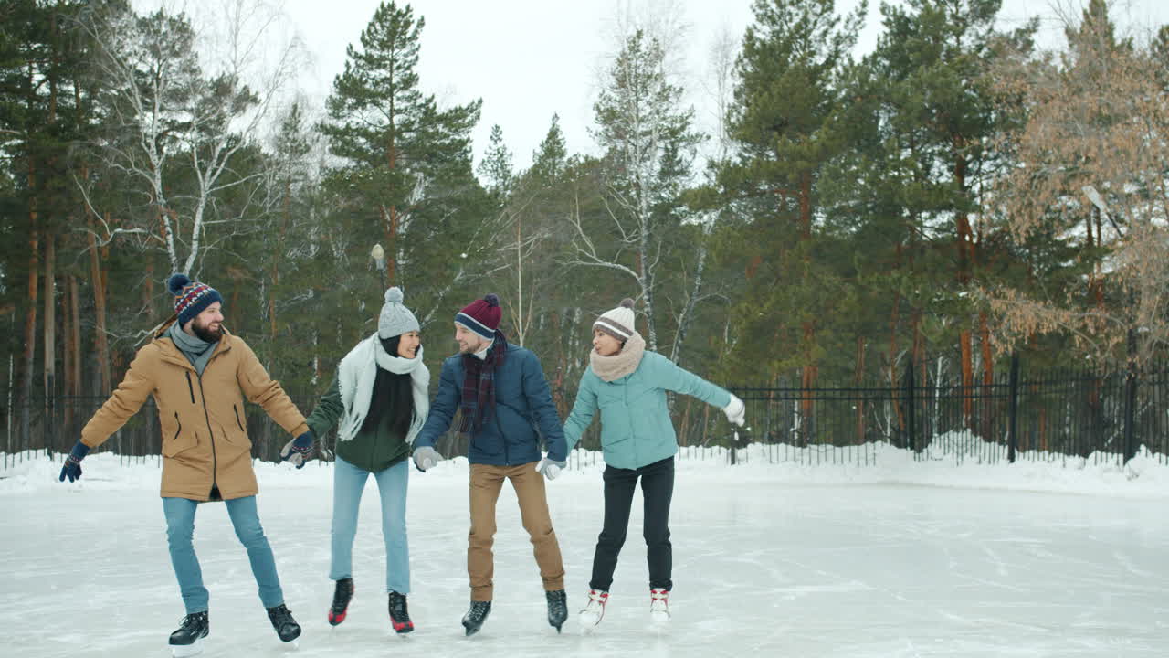 Friends Ice Skating Outdoors in Winter