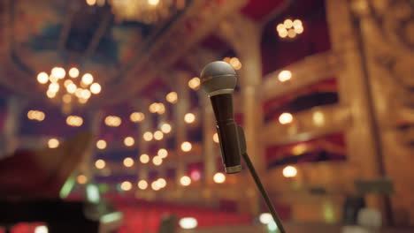 close-up of a microphone on a stage in a concert hall