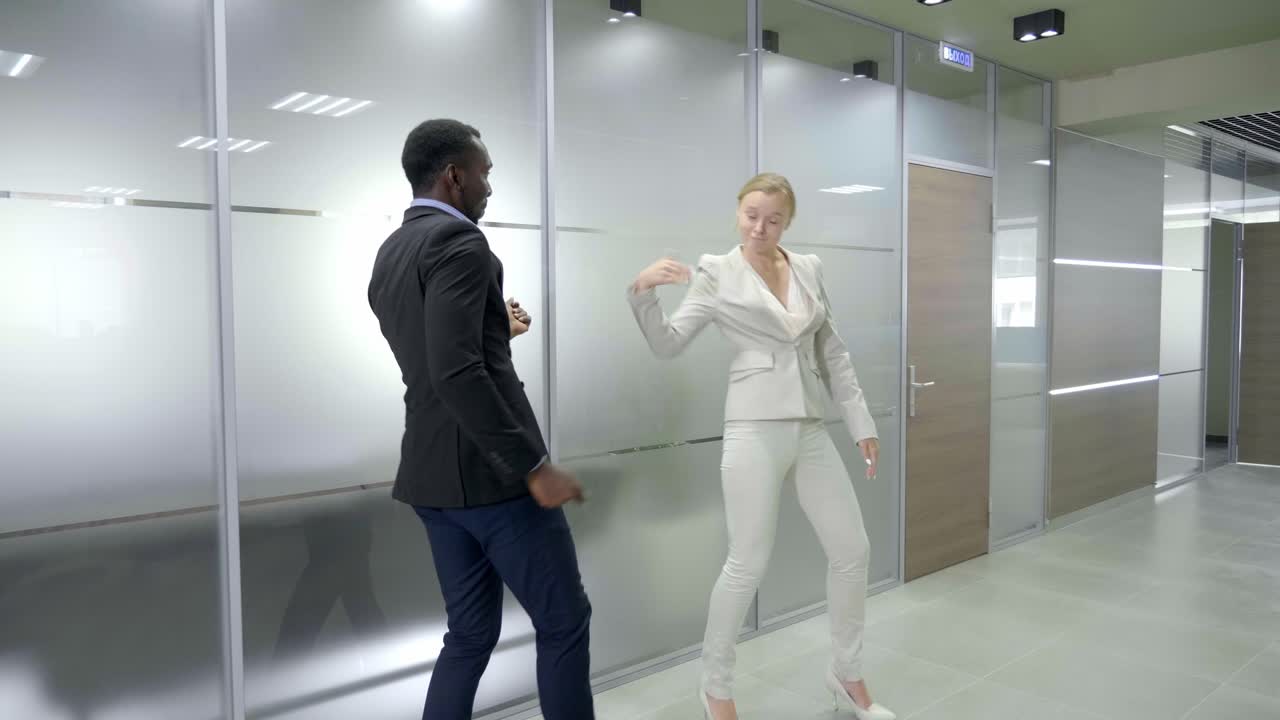 Business People Dancing in Modern Office Corridor