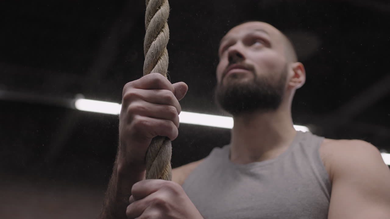 Sportsman Preparing for Climbing a Tightrope