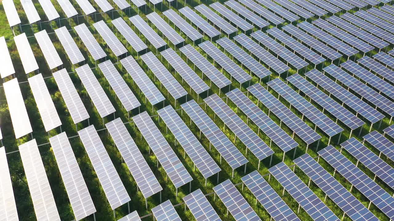 Aerial footage of solar energy modules or panels field, alternative energy concept