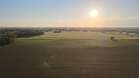 Flying-through-beautiful-farmland-at-sunset
