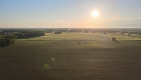 flying through beautiful farmland at sunset