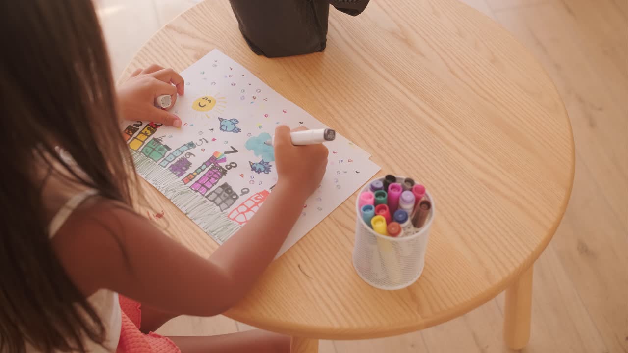 Child drawing at a table