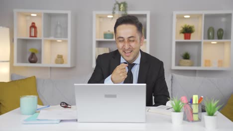 home office worker man making cute gesture at camera.