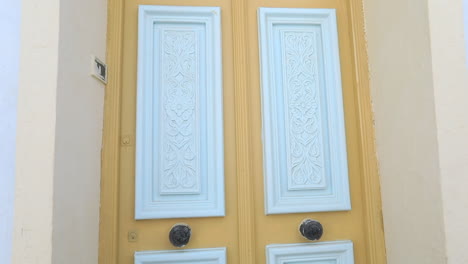 brightly painted traditional door in a historic tunisian city