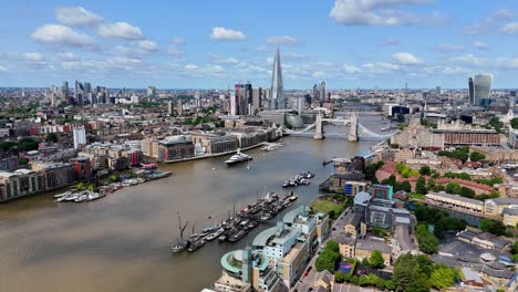flight over river thames heading west toward tower bridge, unveiling a striking mix of historic charm and modern skyscrapers defining london’s evolving skyline.