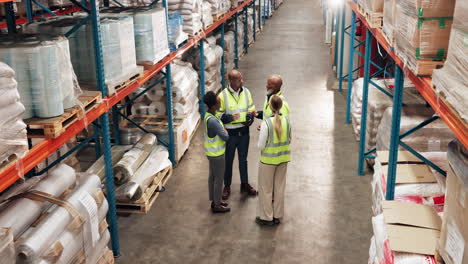 warehouse workers meeting and discussing inventory