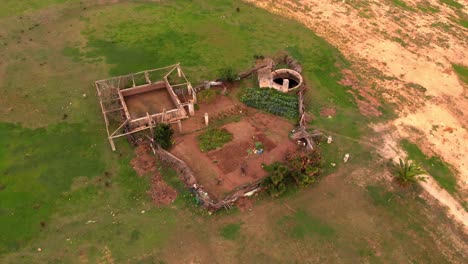 areal drone shot off a small farm in a green pasture. birds eye view off a small holding with agricultural interest.