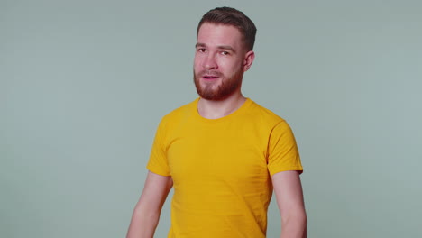 stylish man looking approvingly at camera showing ok gesture like sign positive something good