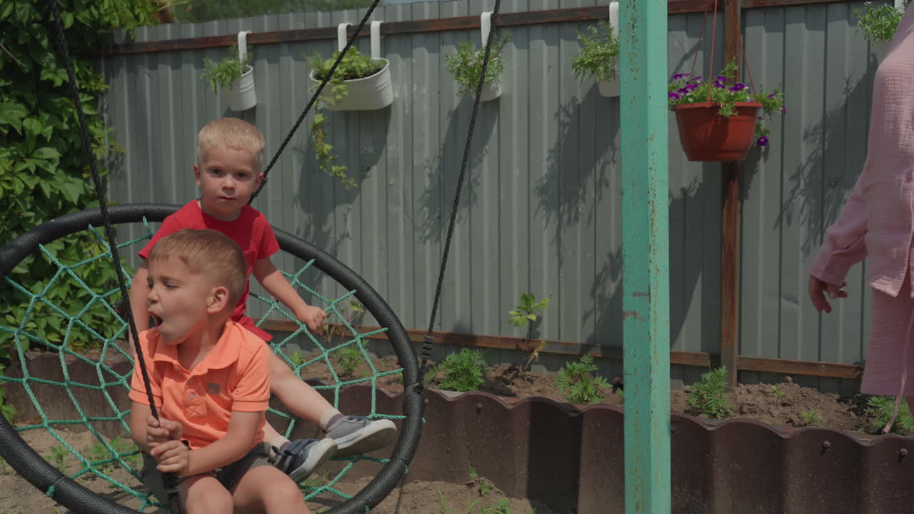 Kids Sharing Fun In Sunny Backyard Scene, Siblings Enjoying Leisure Time In Vibrant Backyard Environment, Young Brothers Engaged In Playful Activities Beneath Bright Summer Sunlight In Backyard