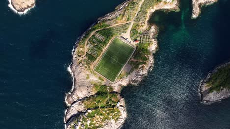 the magical henningsvaer football field seen from an aerial shot in lofoten, norway