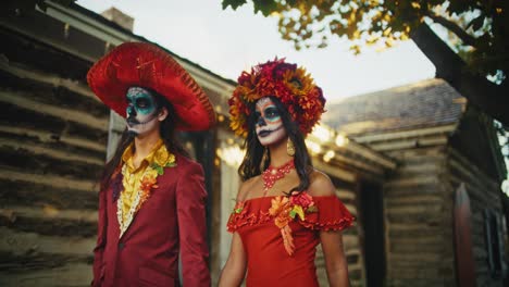 couple in day of the dead costumes