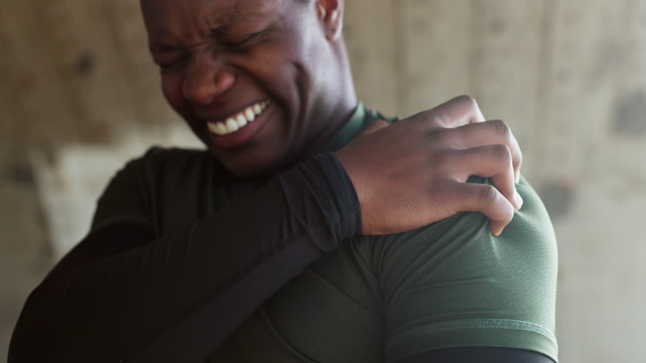 Shoulder pain, hand and man with injury