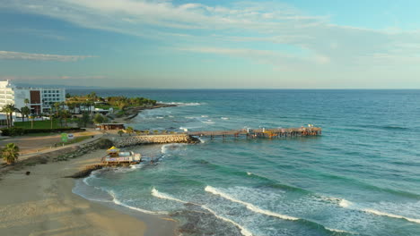 protaras pier and cyprus island coastline at tranquil sunset - aerial side view